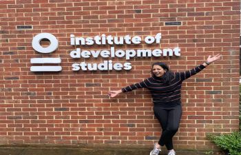 Mahima standing outside the Insitute of Development Studies building