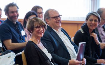 Philanthropic donors Jinny and Andrew Rudd seated at a fundraising event