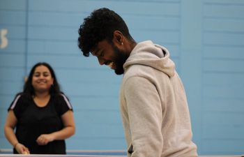 People playing table tennis