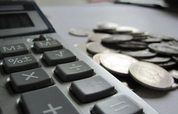 Image of calculator and money