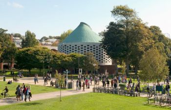 Campus image of the meeting house and library square