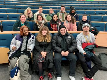 Group photo of Graduate Connectors and SEE Staff members in lecture theatre