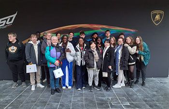 Dr Kevin Masters with students outside the Lamborghini factory