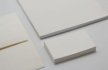 Photogrpah of plain white paper and business cards