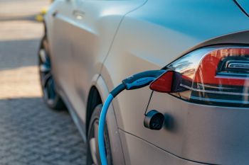 An electric vehicle which is plugged into a charging point