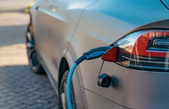 An electric vehicle which is plugged into a charging point