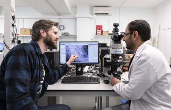 Dr Conor Boland and Adel Aljarid discuss their seaweed-based health sensor development in the lab at the University of Sussex