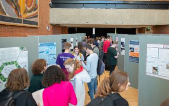 large group of people attending the JRA poster exhibition