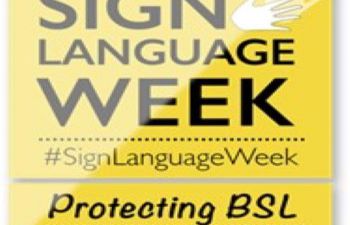 Black wording on a yellow background to publicise sign language week
