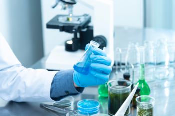 Image of scientist holding test tube