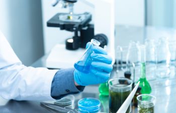 Image of scientist holding test tube