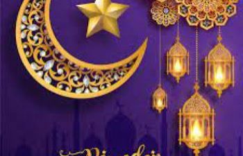 Image of crescent moon and star with Ramadan Kareem message