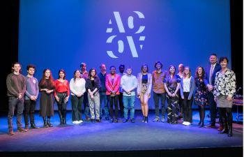 Some of the winners of Pitch for the Planet 2022 stand on stage with the judges