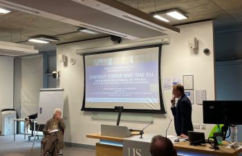 SEI Anniversary Image of Speaker standing in front of white board