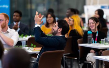 Students applauding at a Spirit of Sussex event