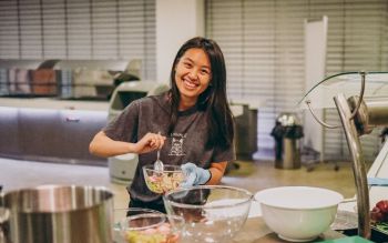 Student enjoying a cooking lesson