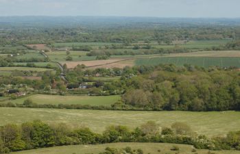 A child running across the South Downs and into a Sussex landscape