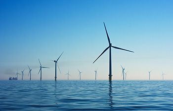 A photo of a wind farm in the sea