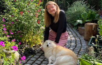 Phillippa Groome and her dog, Nala in the garden