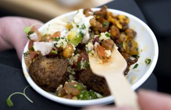 Bowl of healthy food with wooden spoon