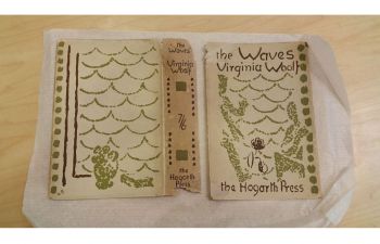 photograph of old handwritten book cover of virginia woolf 'the waves' from archive