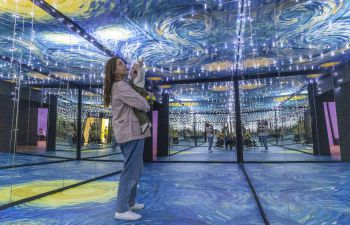 Image of adult and baby at Van Gogh Alive installation at the Brighton Dome