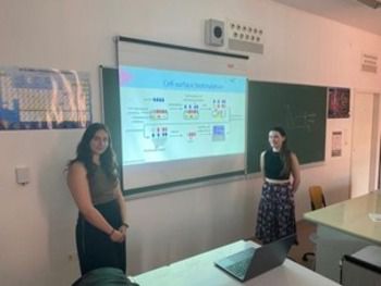 Students Maria and Rosie giving a presentation.