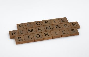 Scrabble pieces saying People remember stories