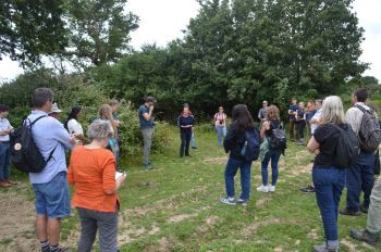 Group of people gathering round during a nature tour