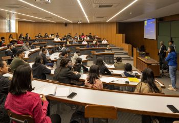 Student sat in a lecture theatre and Ahmedabad University