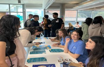 Business School students talking to student ambassadors at the start of term