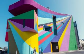 A picture of the Towner Eastbourne building, which is painted with a colourful rainbow mural.