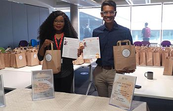 Director and Deputy Director of Student Experience Dr. Rashaad Shabab and Dr. Seun Osituyo handing out recipe bags and meeting students