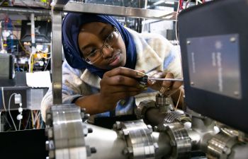 A female student is pictured working on a quantum computer in the University laboratory