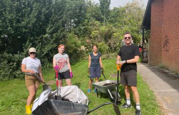 Global Studies PS staff volunteering at community garden