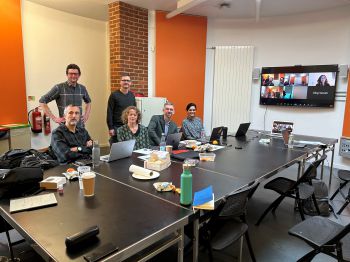 Group of academics around a meeting table