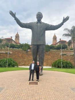 Sasha and Robin by the statue of Nelson Mandela outside the Union Buildings, Pretoria