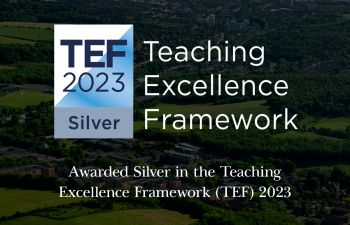 An image of the University campus nestled against the South Downs with text reading 'Teaching Excellence Framework. / Awarded silver in the Teaching Excellence Framework (TEF) 2023