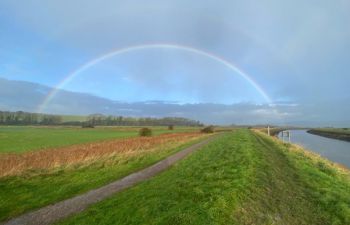 180 degree rainbow seen over a landscape and over the river Ouse in Sussex