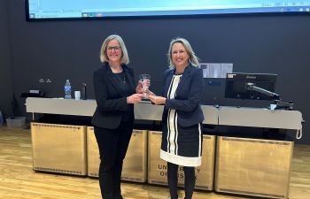 Professor Michelle West presenting Professor Rachel McKendry with the Cornforth Award