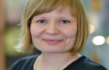 Photo of a headshot of a woman with light blonde hair