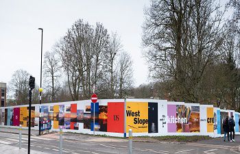 A photo of the artwork hoardings around the West Slope development