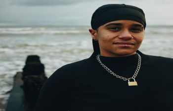 A photo of Subira Joy standing on a beach