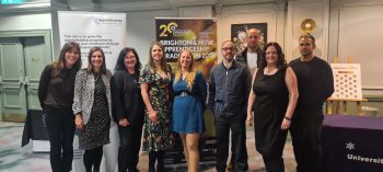 A photo of University of Sussex apprentice graduates (front row, L-R); Charlotte Littlejones, Eleanor Cartwright, Joanna Dale, Francesca Marks-Dennis, Gemma Harman, Terry Cooper, Kelly Feldman. (Back row) Aaron Munnery and Ben Ospalak