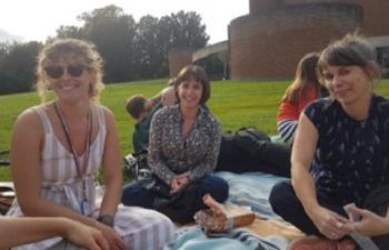 Staff sitting on ACCA lawns