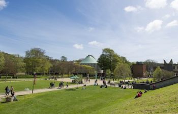 A photo of the University of Sussex Campus with the Meeting House in the background