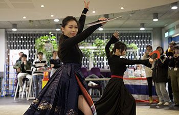 Students the Chinese Students and Scholars Association (CSSA) dancing in Jubilee cafe