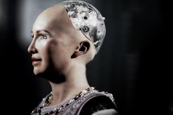 Image of a female AI robot, with human face and AI brain