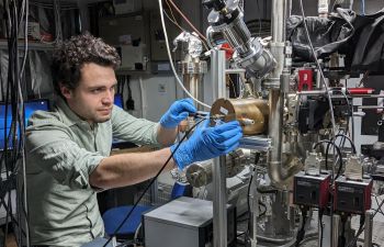 Dr Foni Raphaël Lebrun-Gallagher working on a piece of equipment