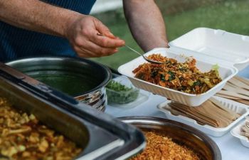 Sussex Uni Food cook serving food on campus